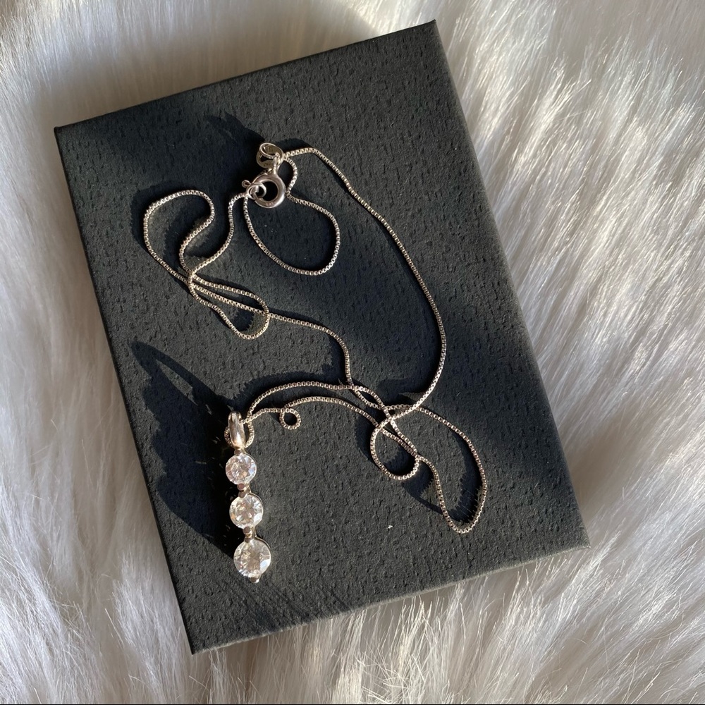 Three stone cubic zirconia and silver necklace
